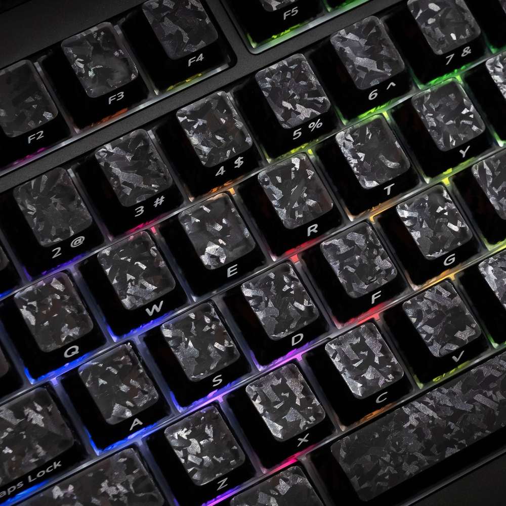 Akko Glassy Carbon Fiber PC plus ABS keycaps with RGB light glowing through the translucent pattern